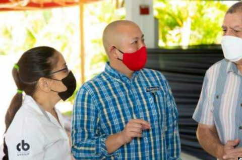 Agriculture Minister Audley Shaw (right) speaks to CEO of CB Group Matthew Lyn (centre) and senior manager, livestock support at Nutramix Dr Gabrielle Young after the launch of a new initiative to boost dairy and beef cattle production.